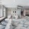 a room with white couches and tables