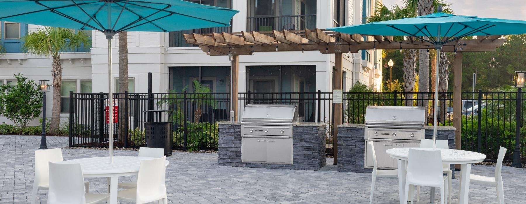 a patio with tables and chairs