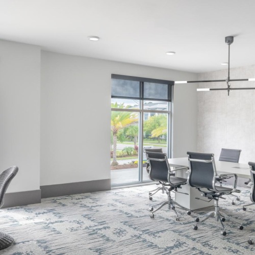 Everything within reach a room with a table chairs and a window