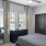 a bedroom with a large window
