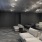 a room with a couch and chairs