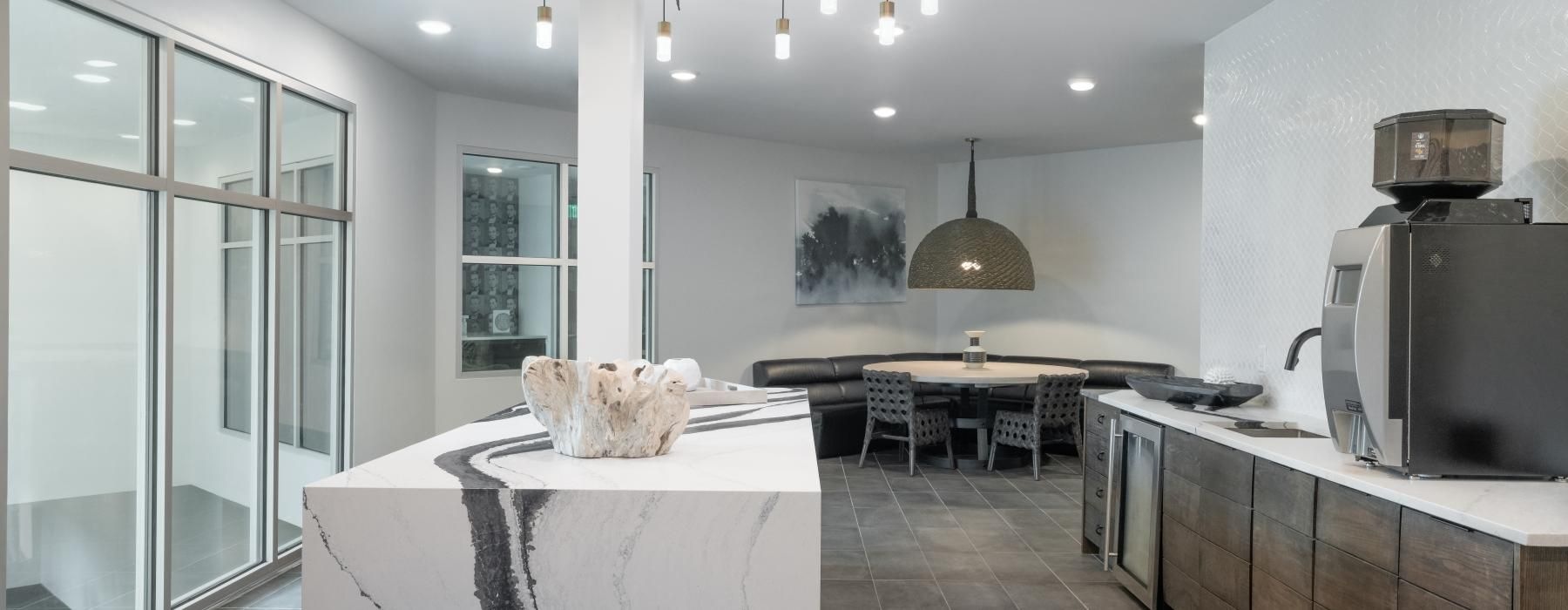 a kitchen with a table and chairs