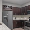 a kitchen with black cabinets