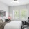 a bedroom with a bed and a chair