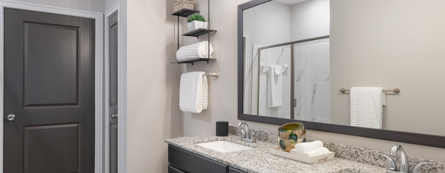 a bathroom with a large mirror