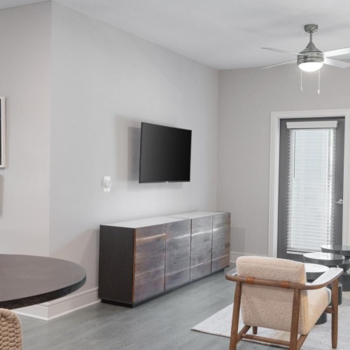 Spacious living areas to recline and recharge a living room with a tv and a table